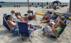 Book club gathering on a beach
